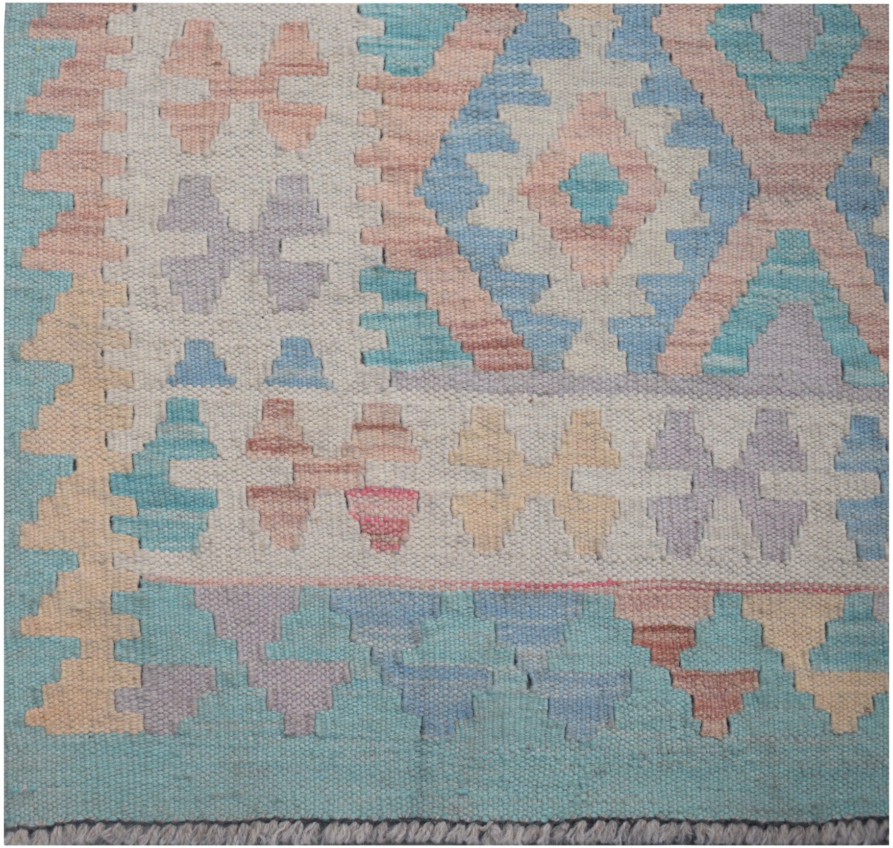 Handmade Afghan Maimana kilim runner featuring a geometric pattern in soft pastel tones.