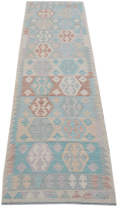 Handmade Afghan Maimana kilim runner featuring a geometric pattern in soft pastel tones.