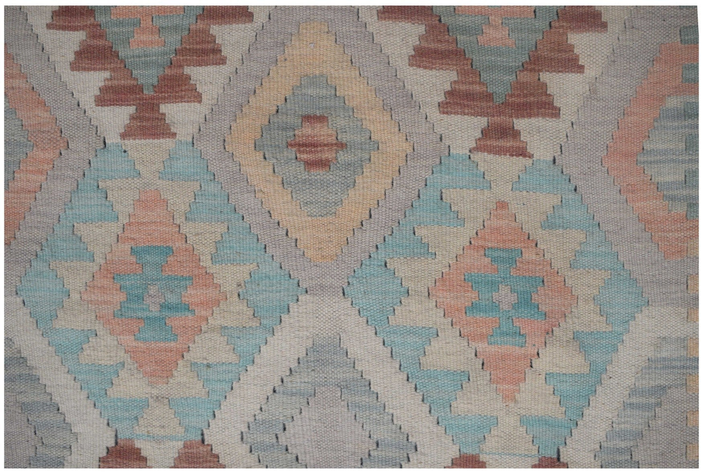 Handmade Afghan Maimana kilim runner featuring a geometric diamond pattern in muted earth tones.