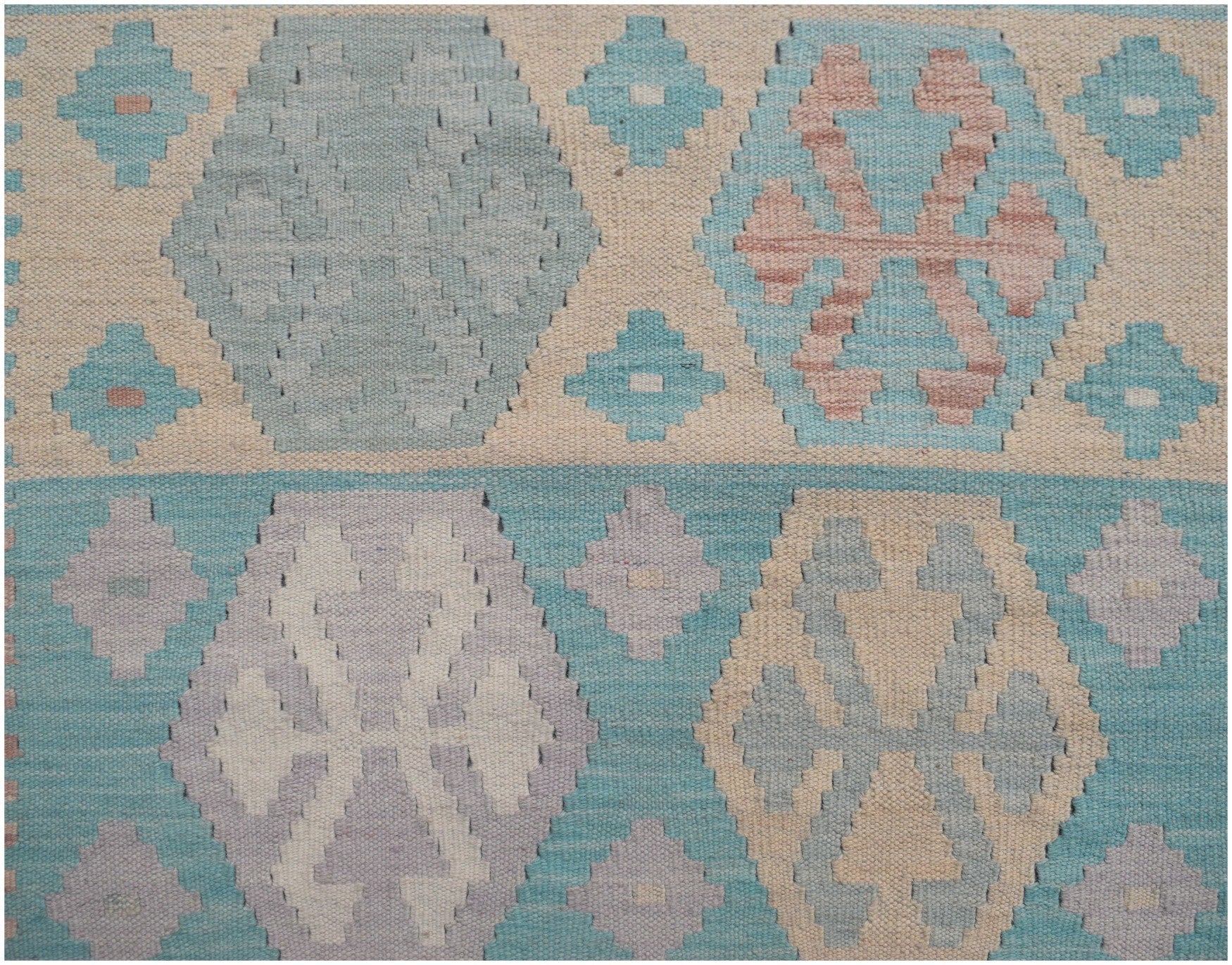 Handmade Afghan Maimana kilim runner featuring a geometric pattern in soft blue and neutral tones.