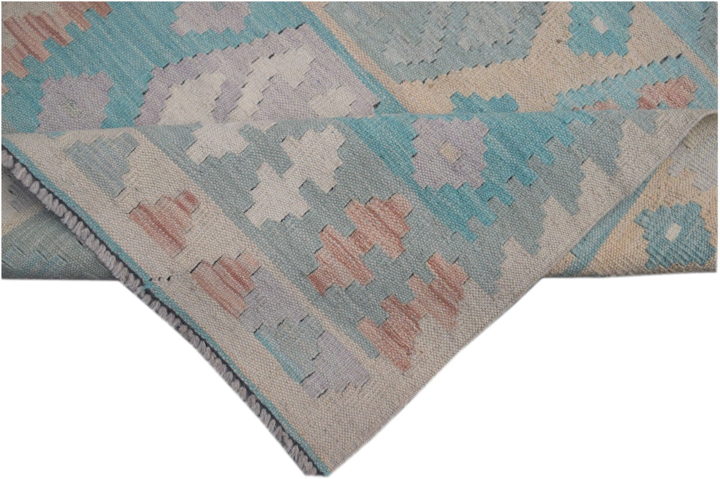 A handmade Afghan Maimana kilim runner featuring geometric patterns in blue, pink, and cream.