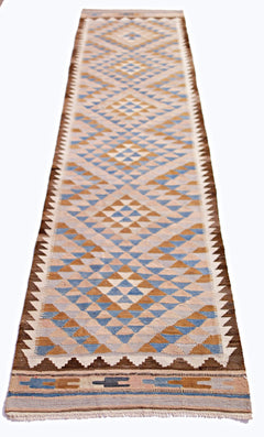 Handwoven Afghan Maimana wool runner featuring a geometric diamond pattern in blue and tan.