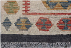 Handmade Afghan Maimana kilim runner featuring geometric patterns in earthy tones and a fringe edge.