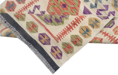 Handmade Afghan Maimana kilim runner featuring colorful geometric patterns on a cream background.