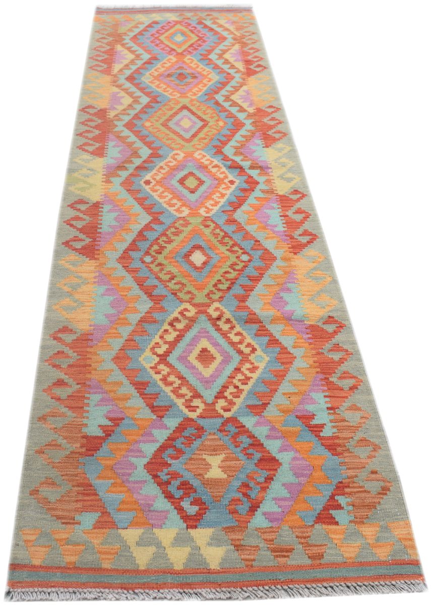 Handmade Afghan Maimana wool runner rug featuring a colorful geometric diamond pattern.