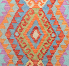 Handmade Afghan Maimana kilim runner featuring a vibrant geometric diamond pattern in wool.