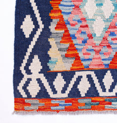Handwoven Afghan Maimana wool kilim runner featuring geometric patterns in blue, red, and white.