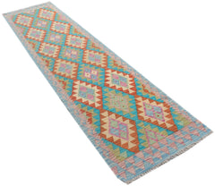 A handmade Afghan Maimana Kilim runner featuring a repeating geometric diamond pattern in vibrant colors.