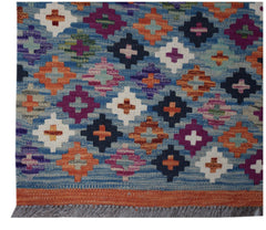 Handwoven Afghan Maimana wool runner featuring a colorful geometric diamond pattern on a blue base.