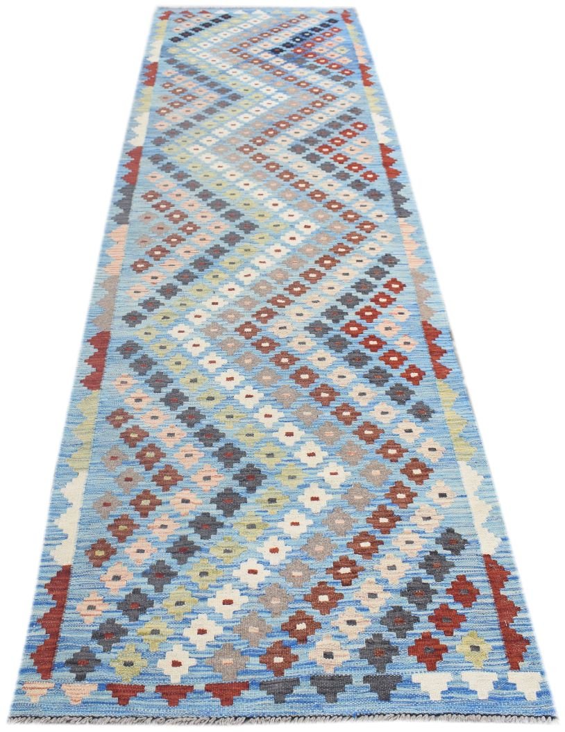 Handmade Afghan Maimana wool runner rug featuring a colorful geometric diamond pattern.