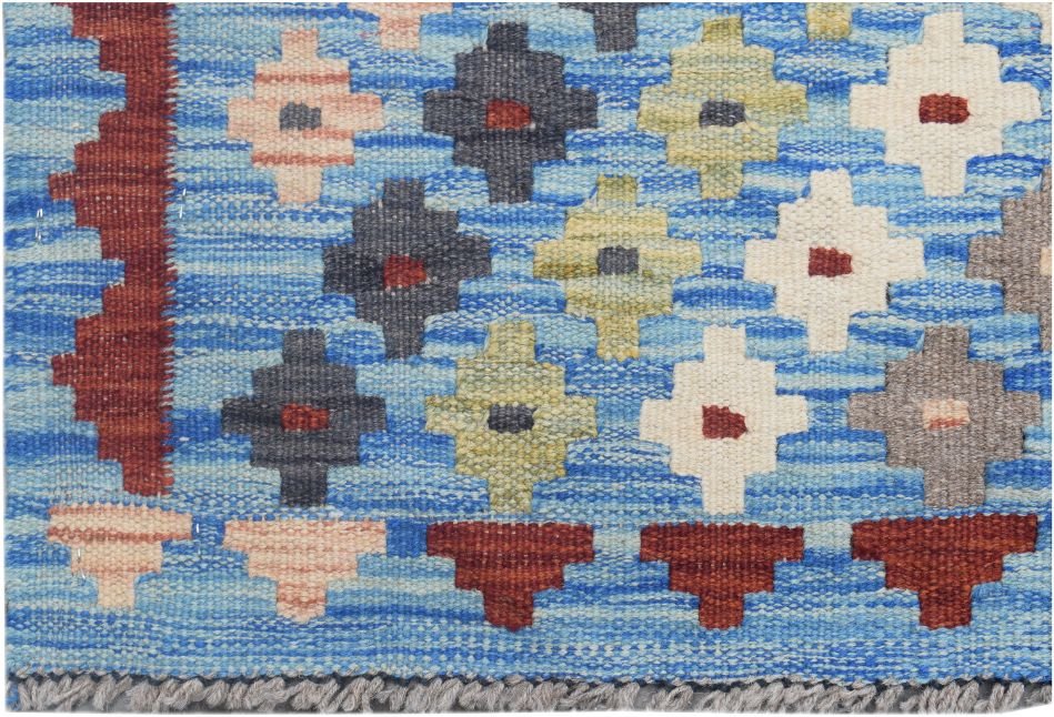 Handmade Afghan Maimana kilim runner featuring a blue background with geometric floral patterns.