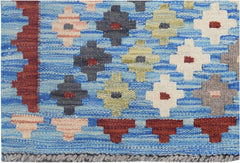 Handmade Afghan Maimana kilim runner featuring a blue background with geometric floral patterns.
