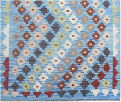 Handmade Afghan Maimana wool runner rug featuring a colorful geometric diamond pattern on blue.