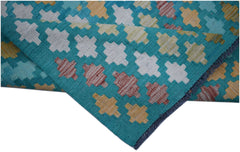 Handwoven Afghan Maimana kilim runner featuring a geometric pattern in teal, white, and gold.