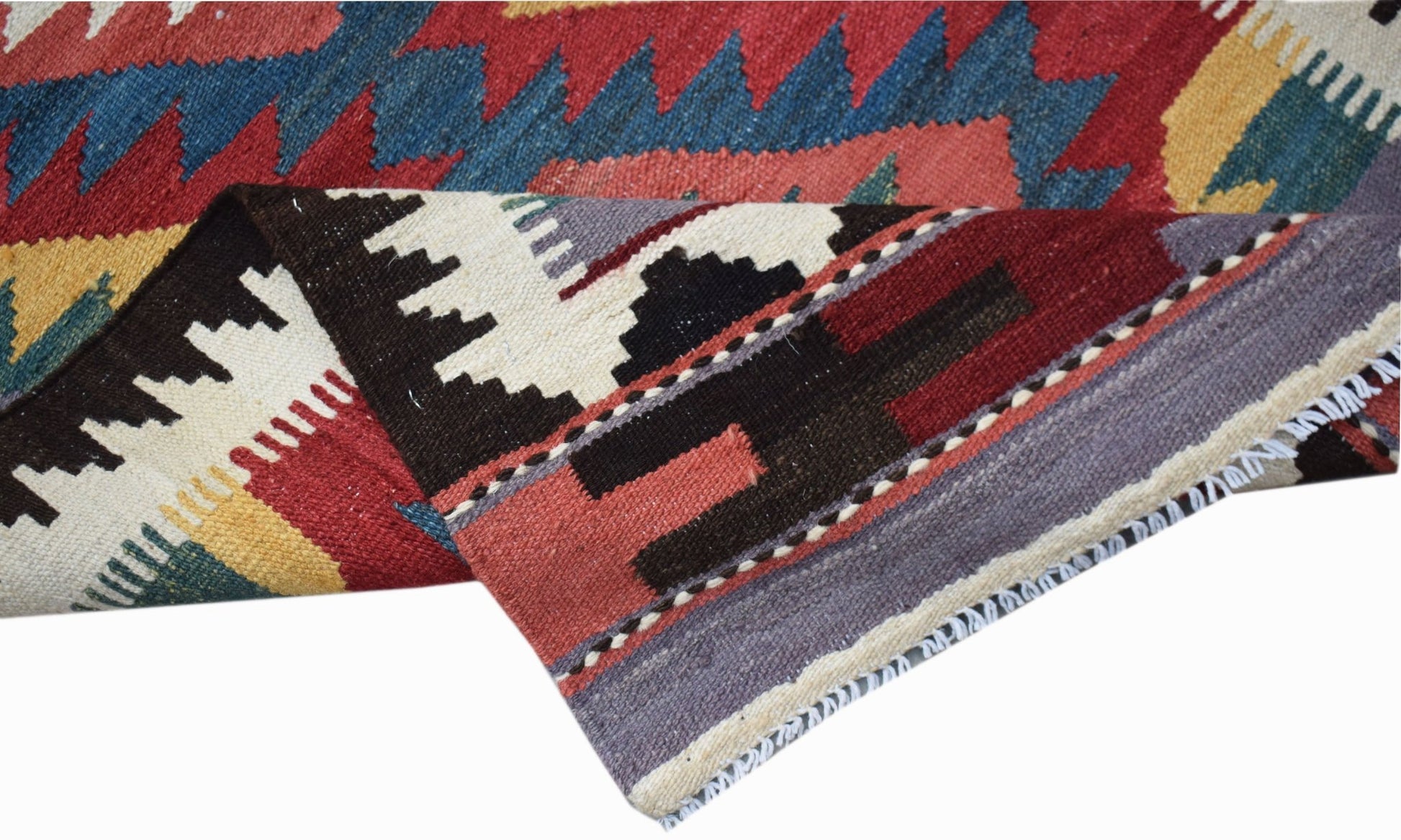 A handwoven Afghan Maimana wool kilim runner featuring geometric patterns in red, blue, and yellow.