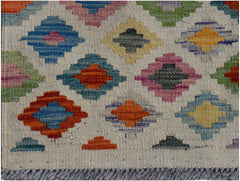 Handwoven Afghan Maimana wool runner featuring a colorful geometric diamond pattern.