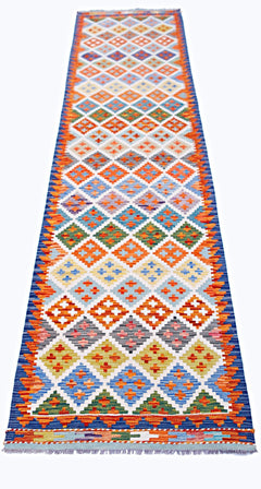 Handwoven Afghan Maimana wool runner featuring a colorful geometric diamond pattern.