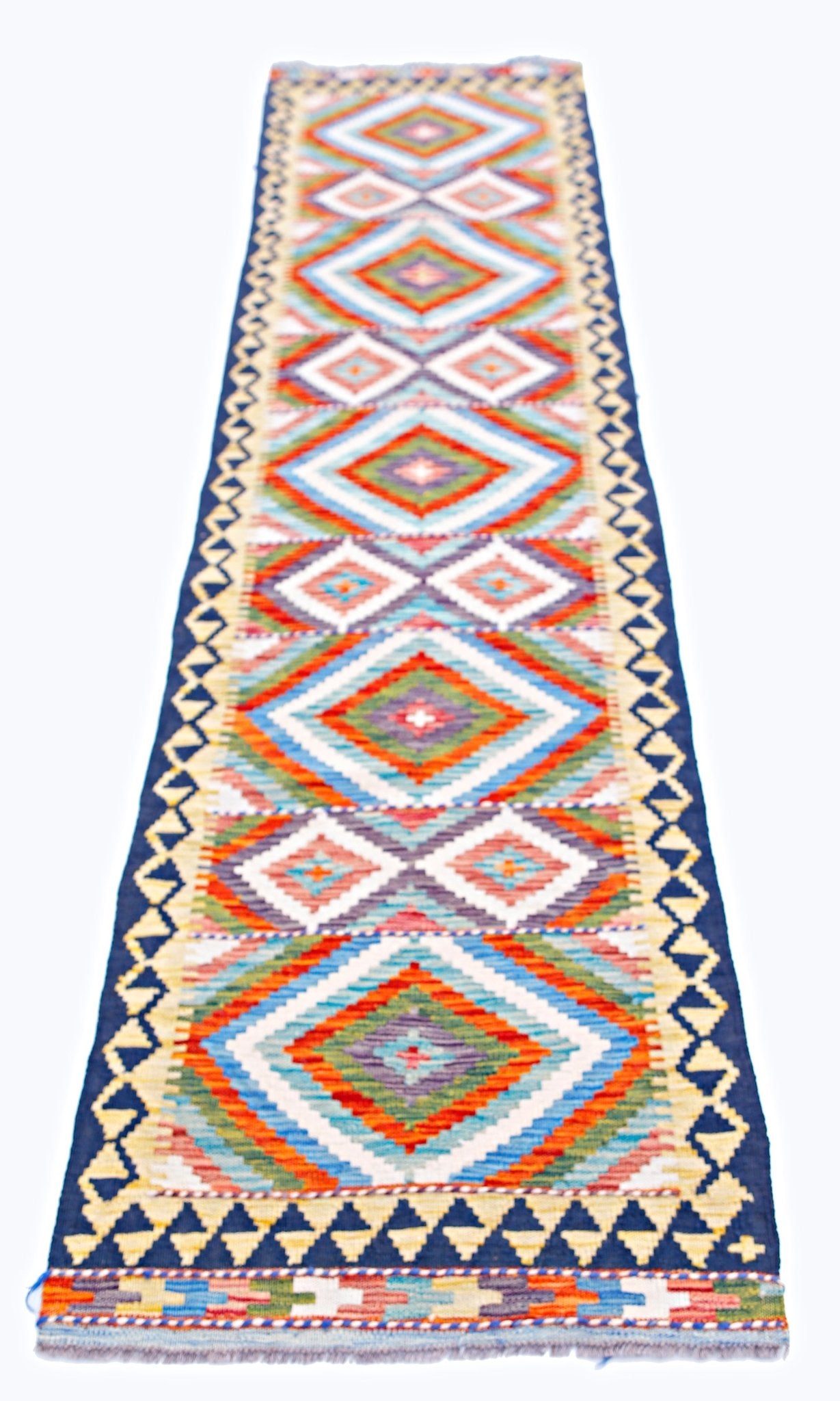 Handwoven Afghan Maimana wool runner rug featuring a colorful geometric diamond pattern.