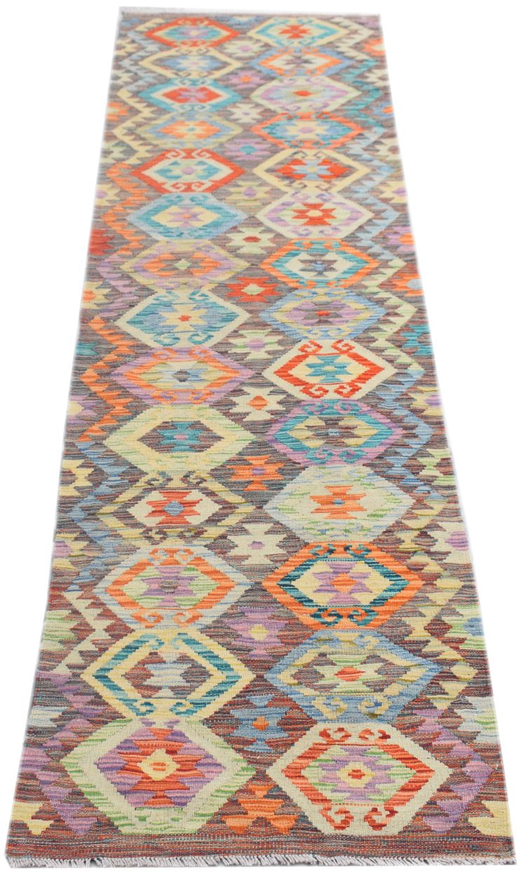 Handmade Afghan Maimana wool runner rug featuring a colorful geometric diamond pattern.