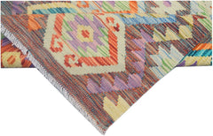 A handmade Afghan Maimana kilim runner featuring vibrant geometric patterns in wool.