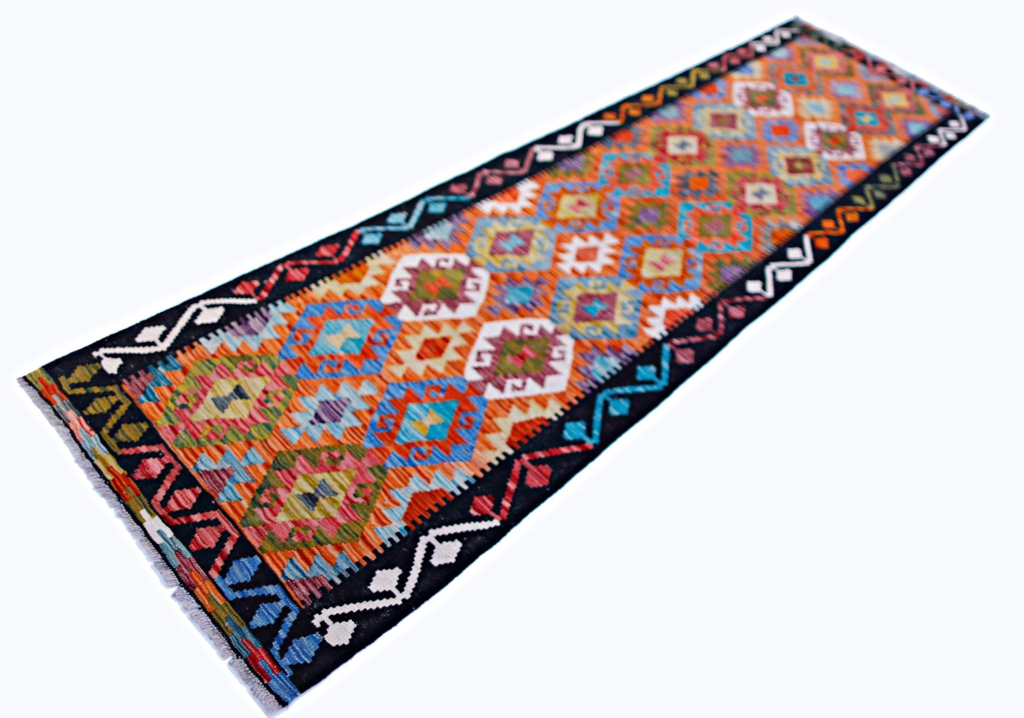 A handmade Afghan Maimana wool runner rug featuring a vibrant geometric pattern on a black border.