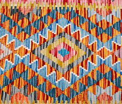 Handwoven Afghan Maimana wool kilim runner featuring a vibrant geometric diamond pattern.