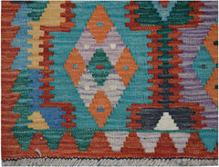 Handwoven Afghan Maimana kilim runner featuring a vibrant geometric pattern in wool.