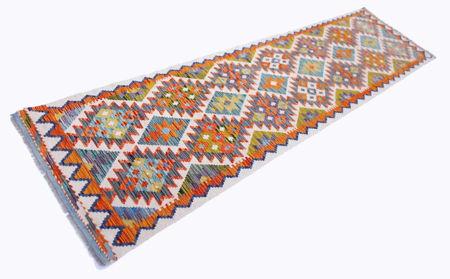 Handwoven Afghan Maimana wool runner rug featuring a colorful geometric diamond pattern.
