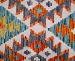 Handwoven Afghan Maimana kilim runner featuring a geometric pattern in orange, blue, and grey.