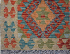 Handmade Afghan Maimana kilim runner featuring a geometric diamond pattern in vibrant colors.