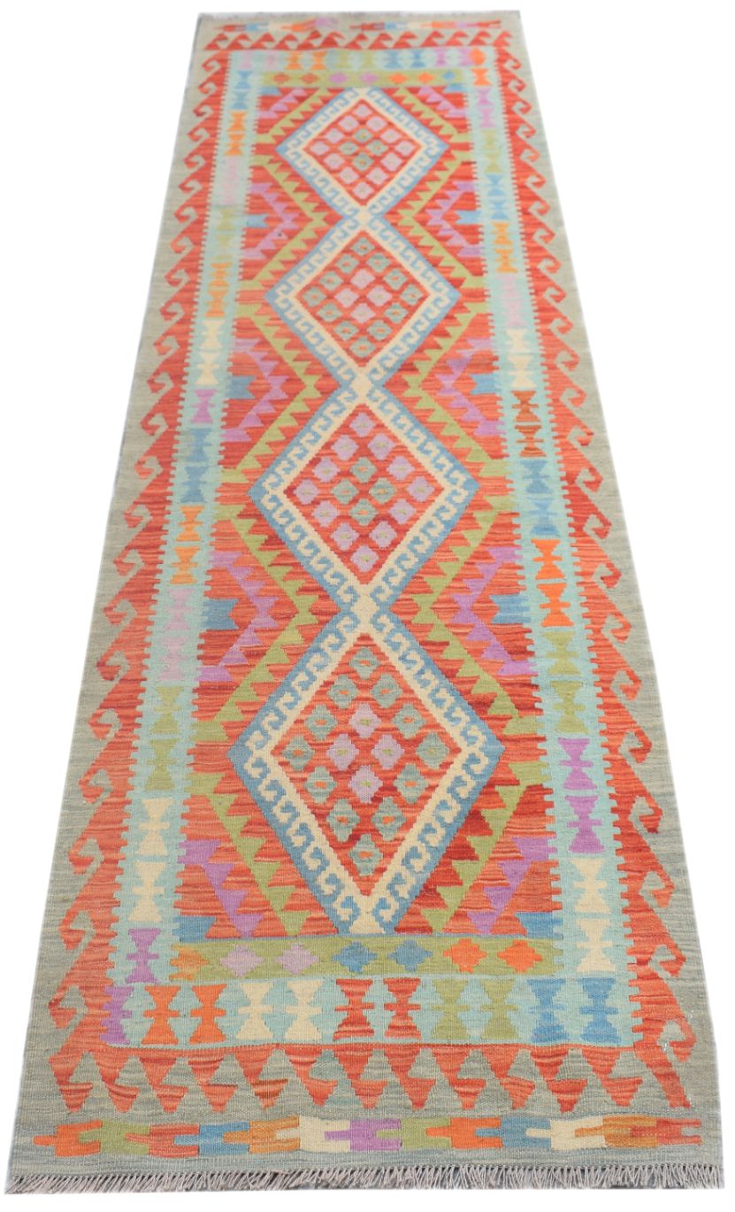 Handmade Afghan Maimana wool runner rug featuring a colorful geometric diamond pattern.