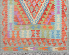 Handmade Afghan Maimana kilim runner featuring a colorful geometric pattern on a light blue base.