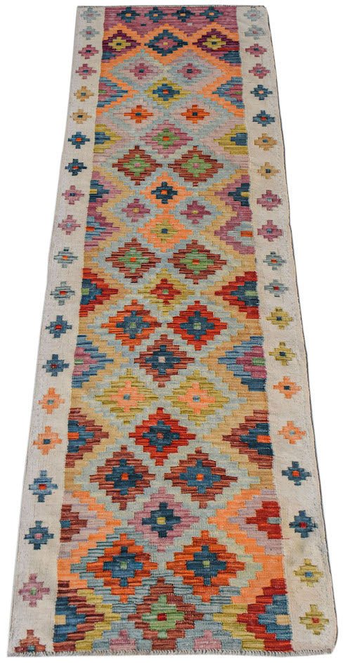 Afghan Maimana Kilim runner with geometric patterns in multiple colors.