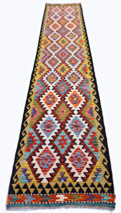 Handwoven Afghan Maimana wool runner rug featuring a vibrant geometric diamond pattern.