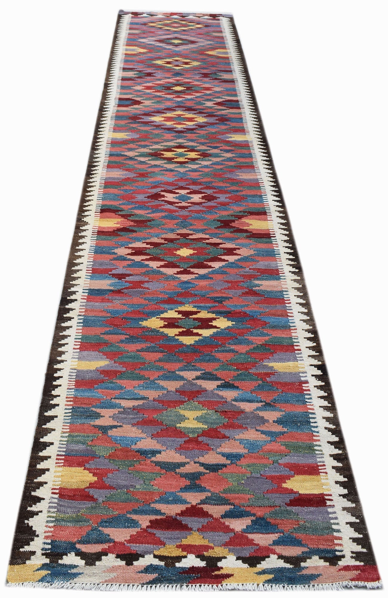 Handwoven Afghan Maimana wool runner rug featuring a colorful geometric diamond pattern.