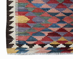 Handwoven Afghan Maimana kilim runner featuring a colorful geometric diamond pattern.
