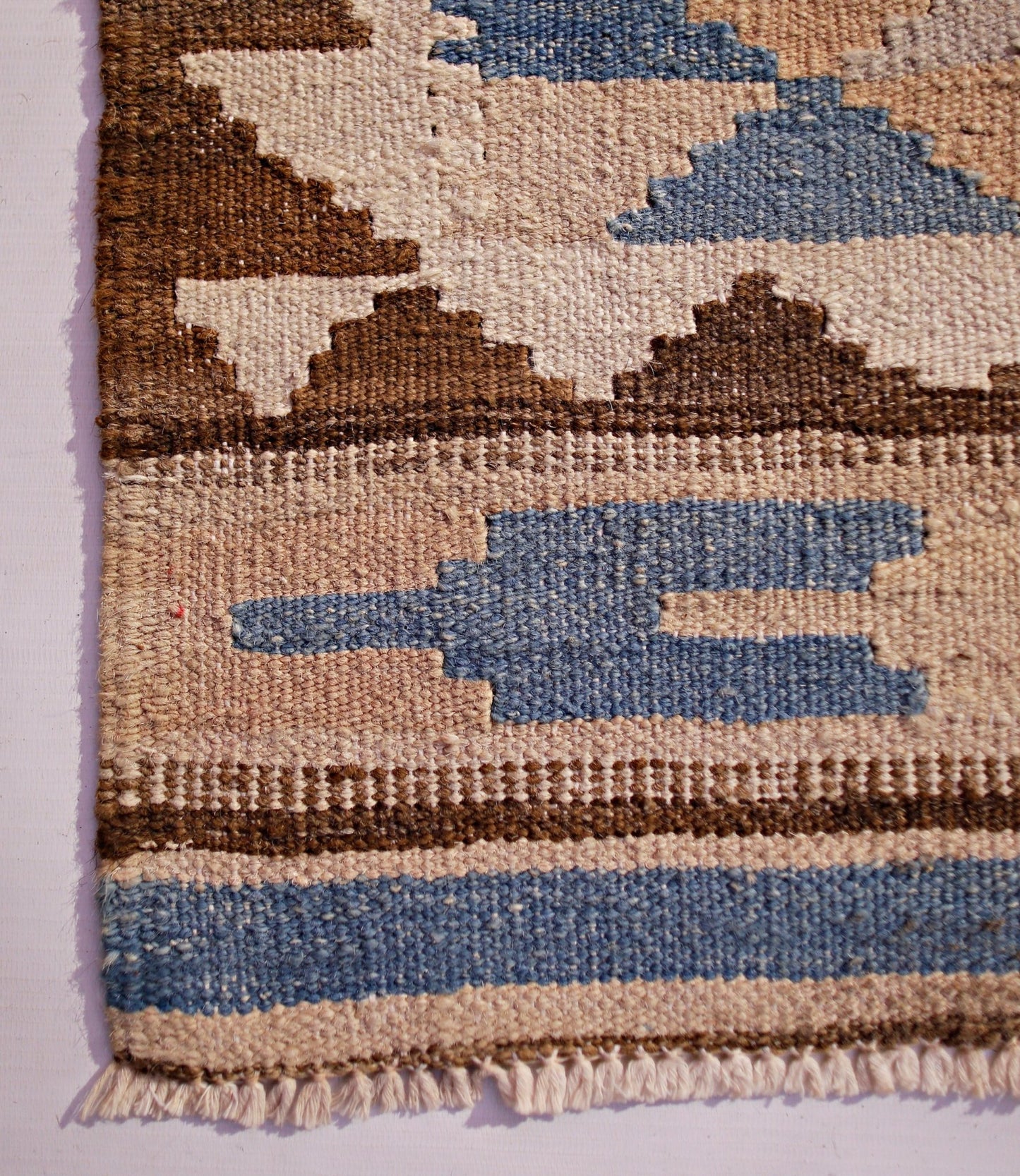 Handwoven Afghan Maimana wool kilim runner featuring a geometric pattern in blue, brown, and cream.