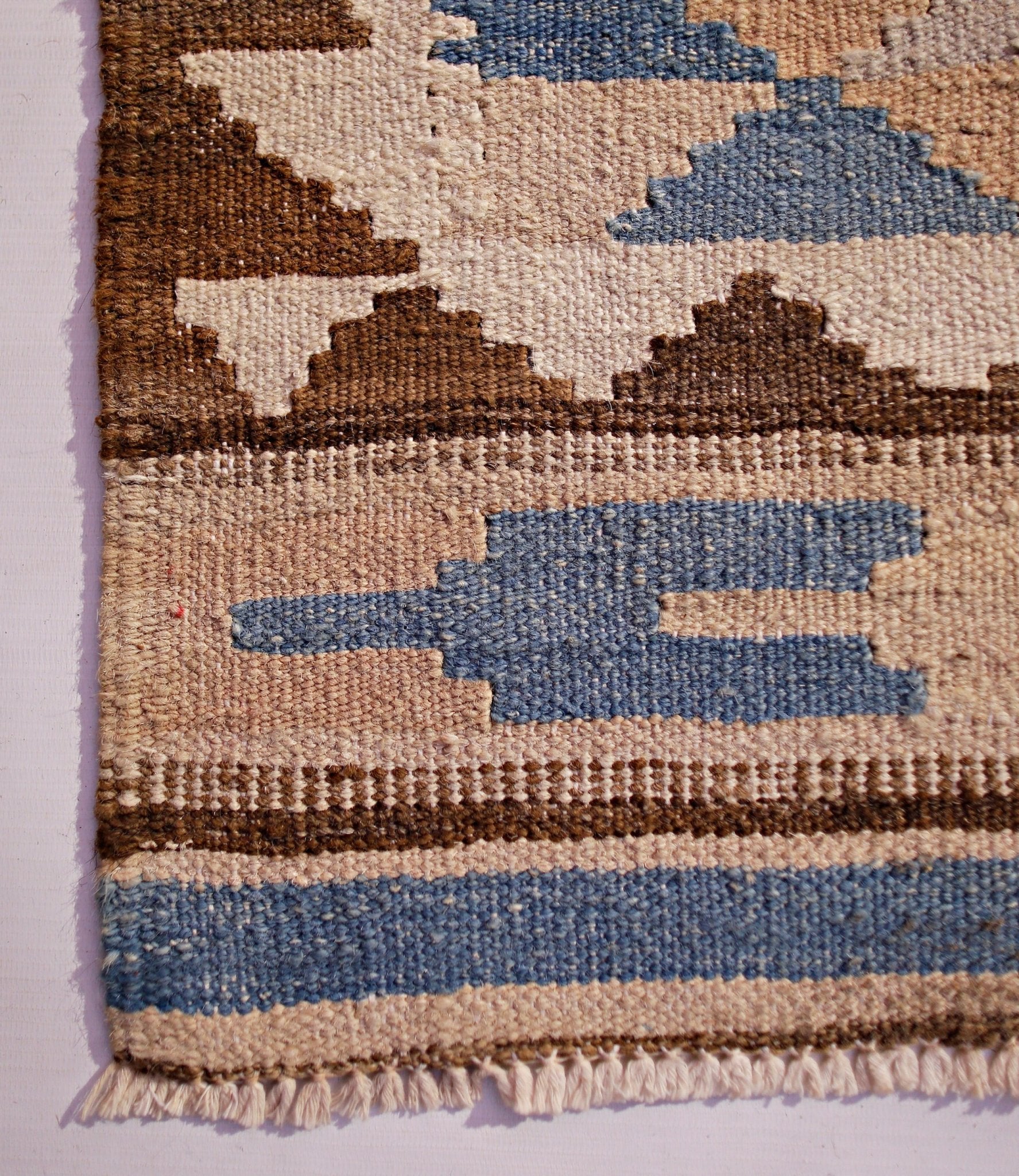 Handwoven Afghan Maimana wool kilim runner featuring a geometric pattern in blue, brown, and cream.
