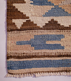 Handwoven Afghan Maimana wool kilim runner featuring a geometric pattern in blue, brown, and cream.