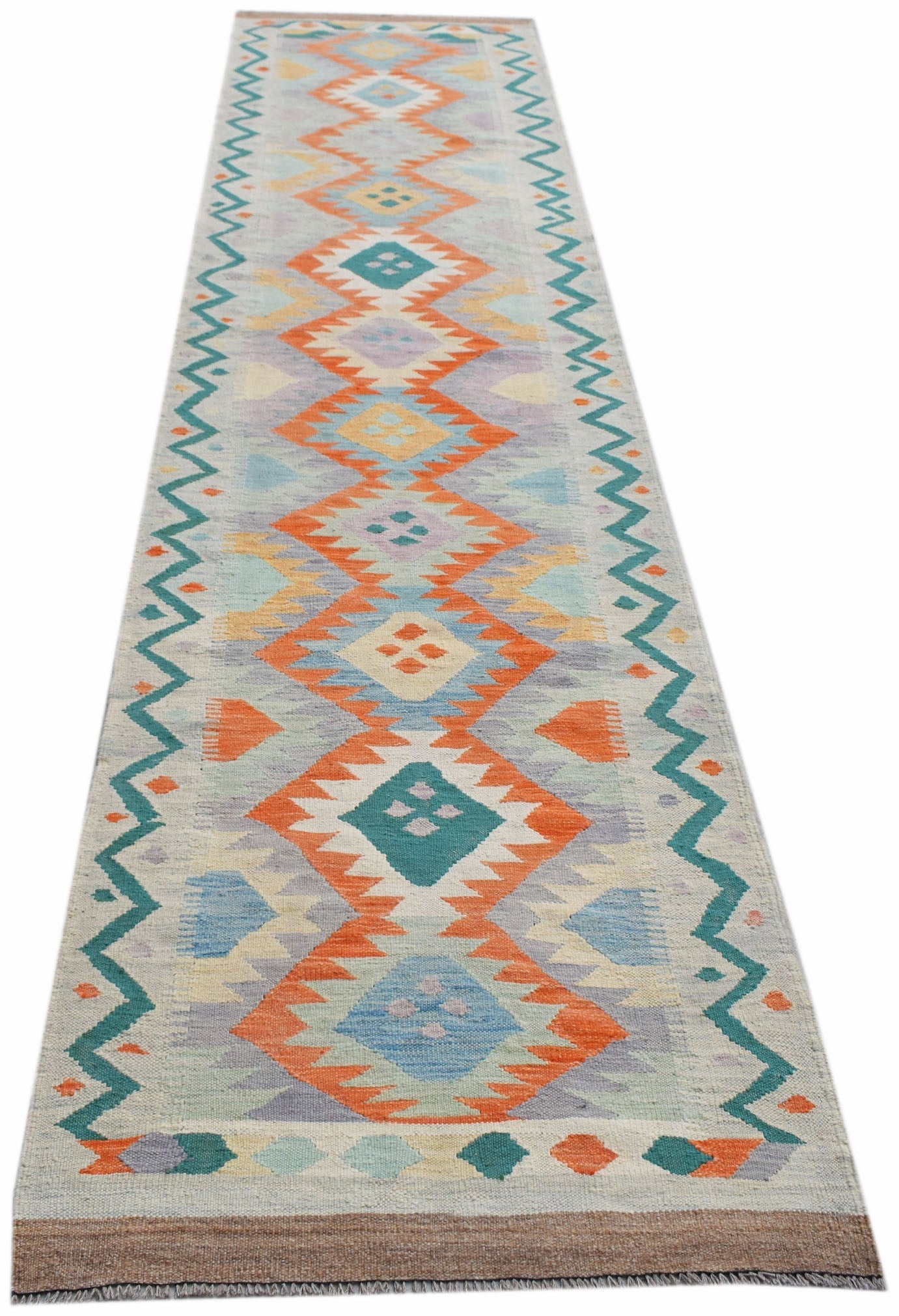 Handwoven Afghan Maimana wool runner rug featuring a colorful geometric diamond pattern.