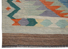A handwoven Afghan Maimana wool kilim runner featuring geometric patterns in vibrant colors.