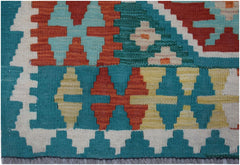 Handwoven Afghan Maimana kilim runner featuring a geometric pattern in vibrant wool colors.