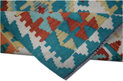 A handmade Afghan Maimana kilim runner featuring a geometric pattern in teal, orange, and cream.