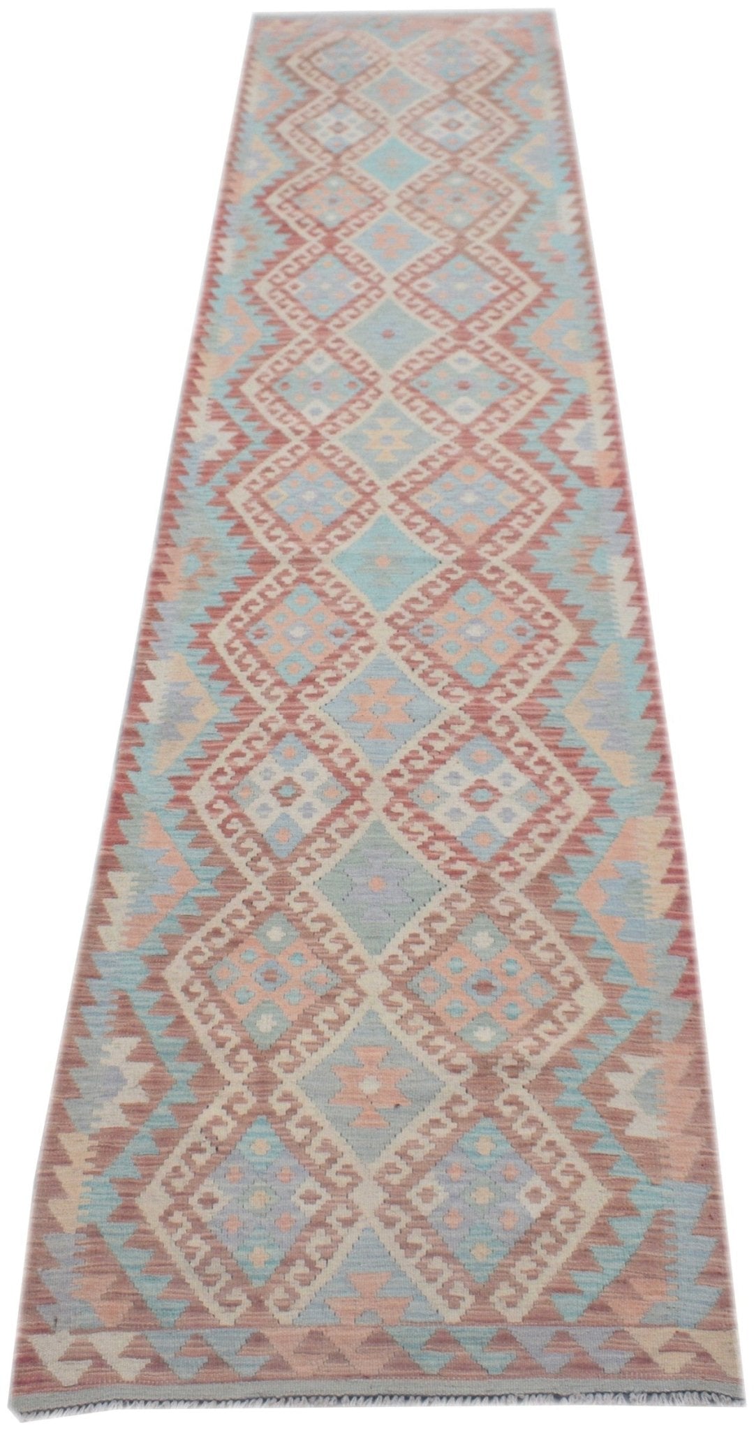A handmade Afghan Maimana wool runner rug featuring a repeating geometric diamond pattern in soft pastel tones.