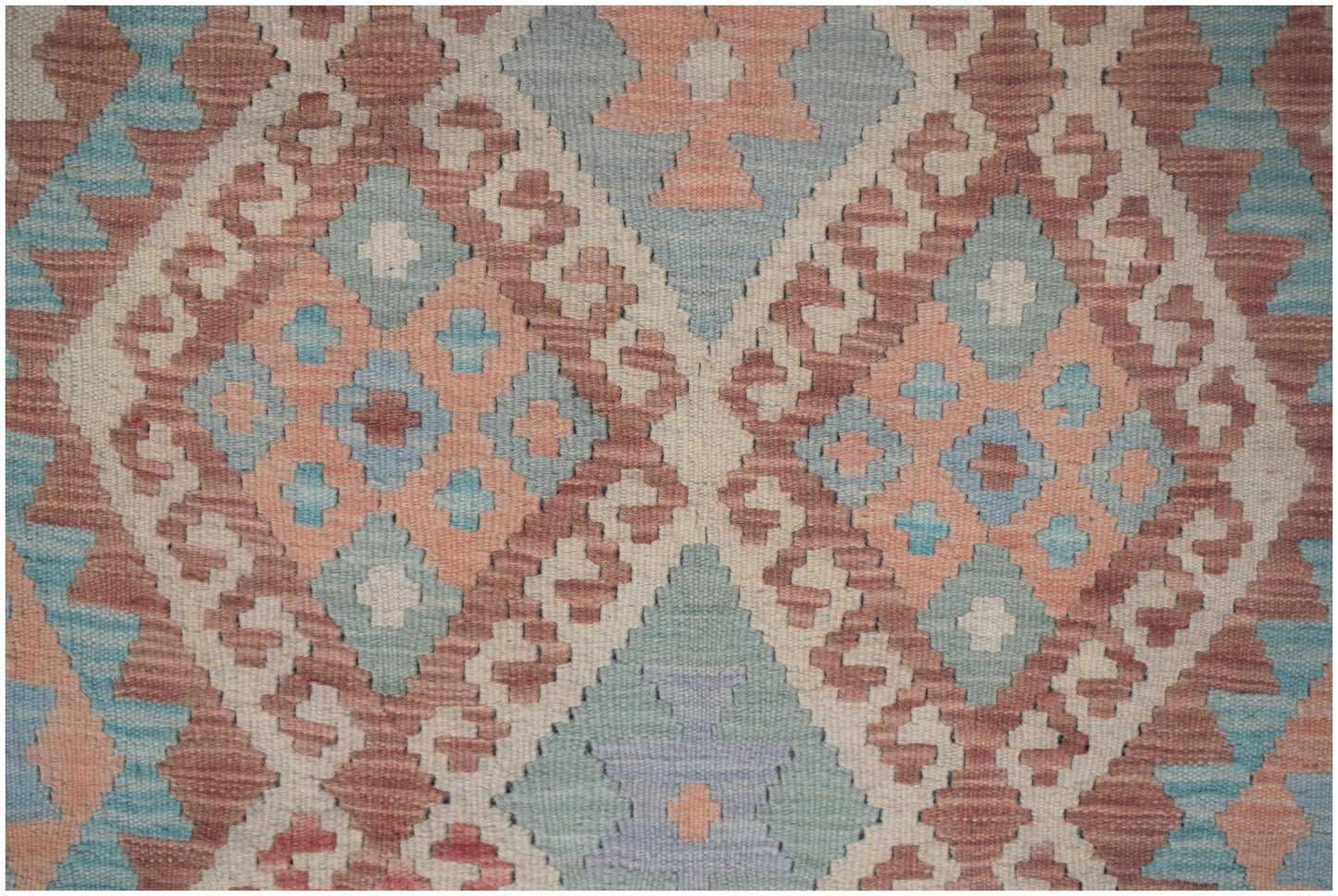Handmade Afghan Maimana kilim runner featuring a geometric diamond pattern in muted earth tones.