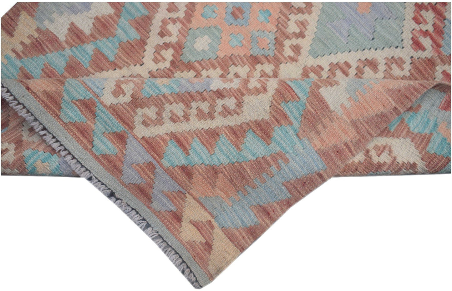 Handmade Afghan Maimana kilim runner featuring geometric patterns in muted red, blue, and cream.