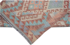 Handmade Afghan Maimana kilim runner featuring geometric patterns in muted red, blue, and cream.