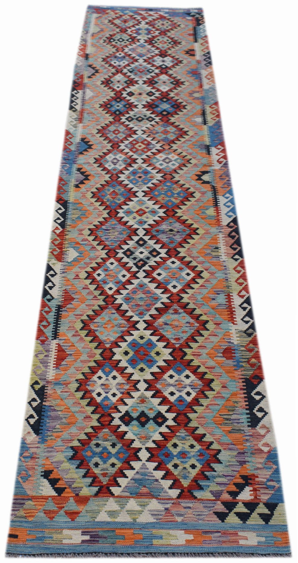 A handmade Afghan Maimana wool runner rug featuring a vibrant geometric diamond pattern.