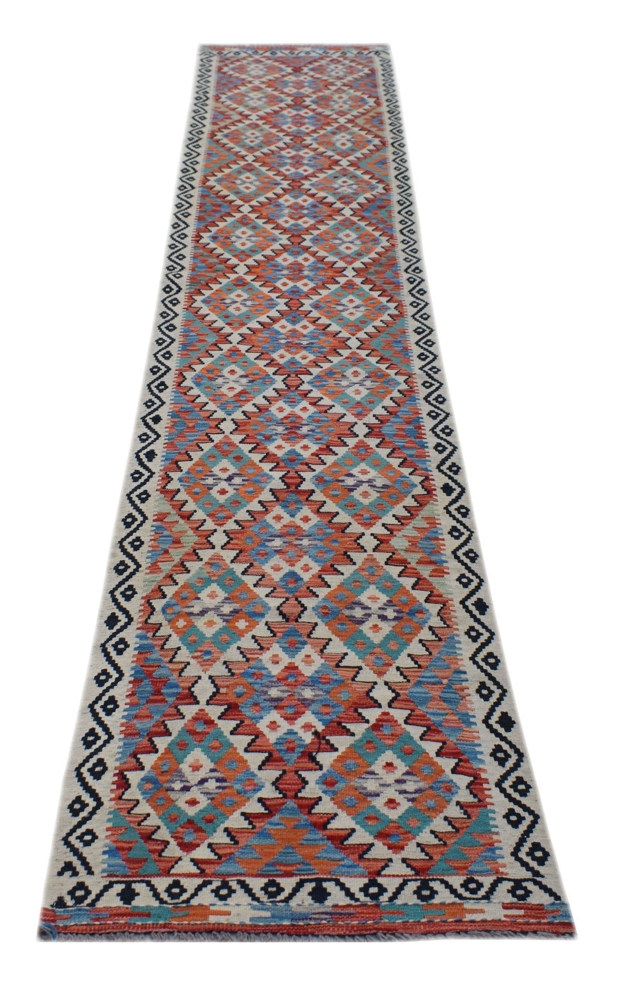 A handmade Afghan Maimana wool runner rug featuring a colorful geometric diamond pattern.