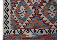 Handwoven Afghan Maimana wool runner featuring a geometric diamond pattern in vibrant colors.